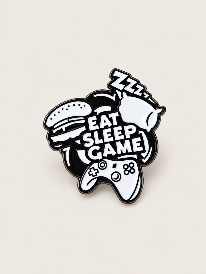 Eat Sleep Game Controller Pin shown on a warm neutral background