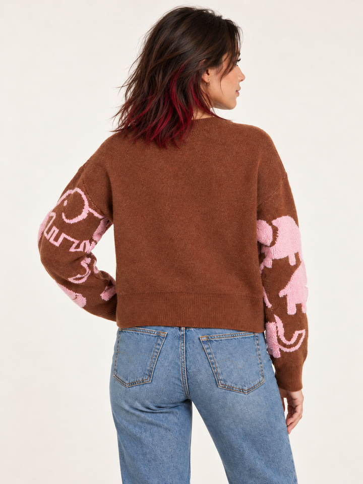 Rust elephant sweater back view on model