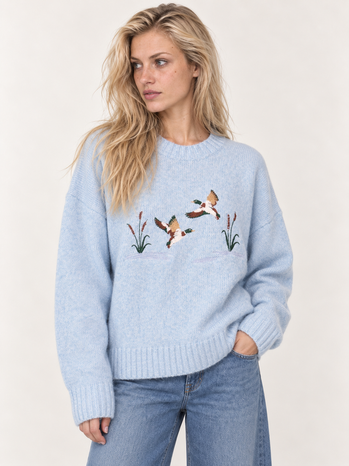 Light blue embroidered ducks sweater front view