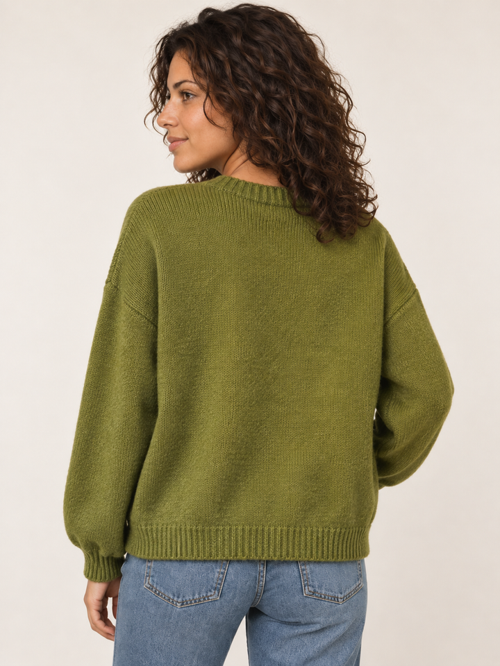 Back view of green embroidered monarch butterfly sweater