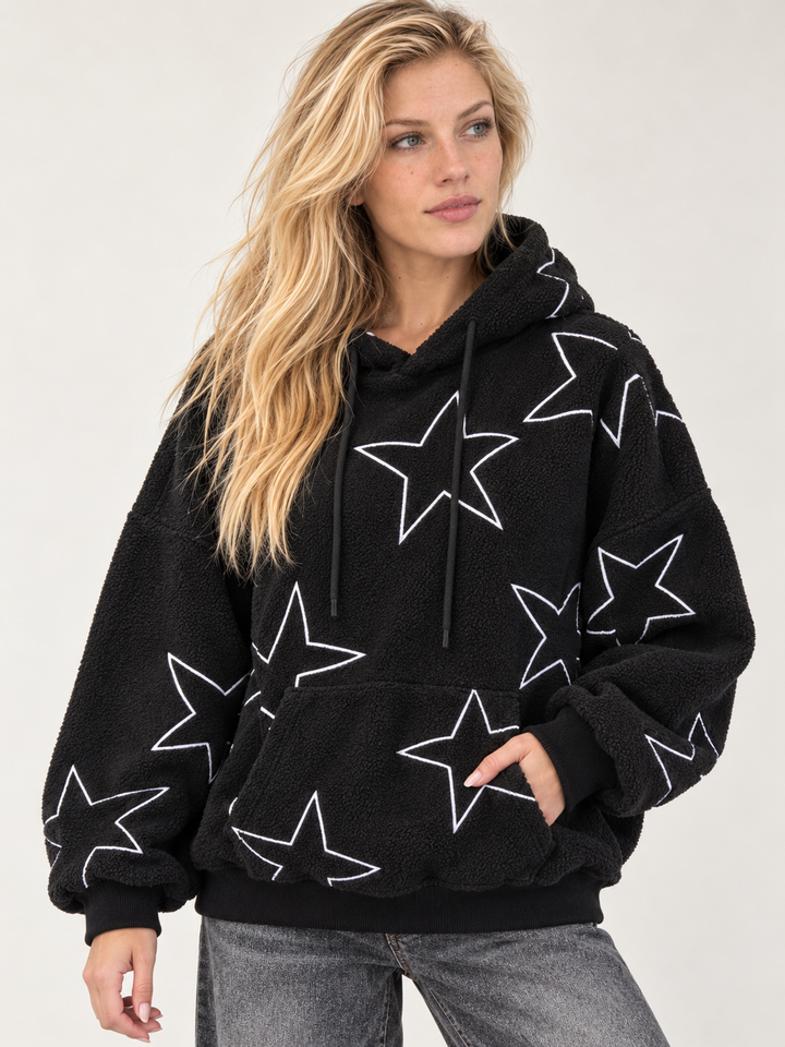 Model wearing the Embroidered Star Sherpa Hoodie Black — front view