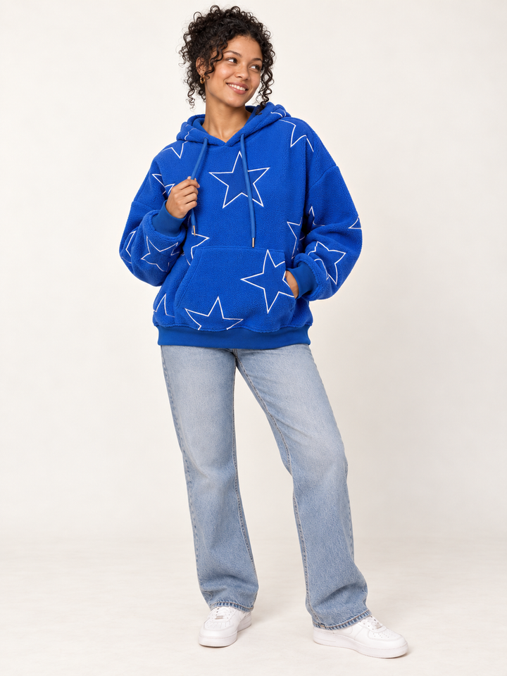Model wearing Embroidered Star Sherpa Hoodie Blue, full-body view