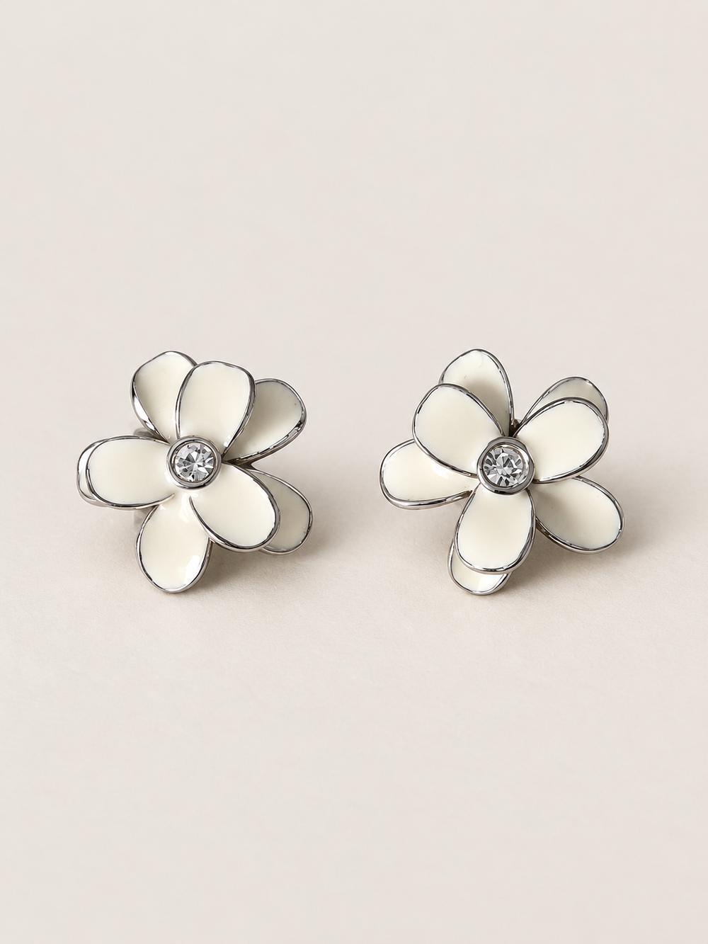 Enamel Flower Stud Earrings white main on a warm neutral background