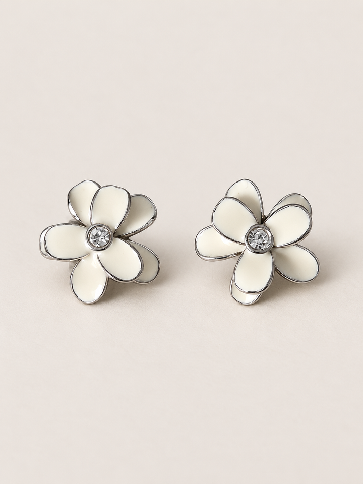 Enamel Flower Stud Earrings white main on a warm neutral background