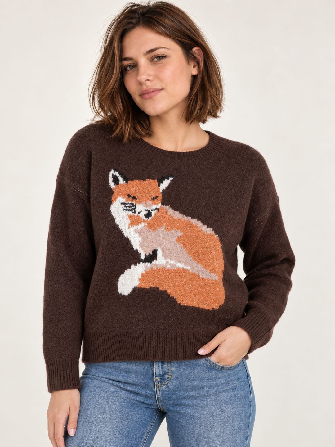Model wearing Fox Graphic Sweater Brown, front view