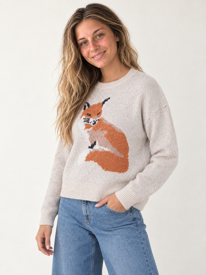 Model wearing Fox Graphic Sweater Taupe — three-quarter view