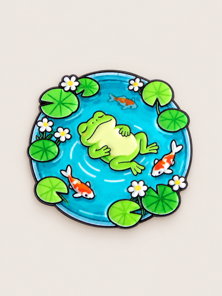 Frog and Koi Pond Pin shown on a warm neutral background