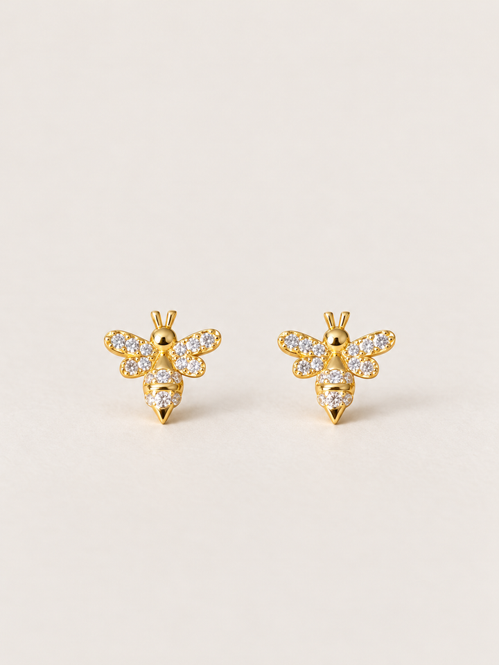 Gold Crystal Bee Stud Earrings shown on a warm neutral background
