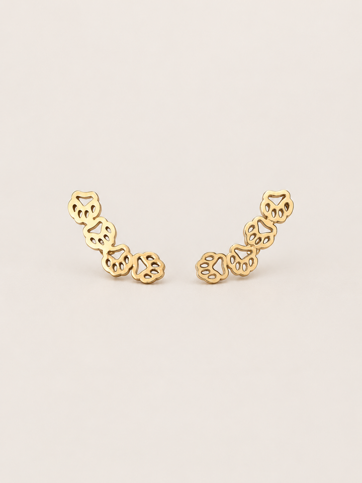 Gold Owl Ear Crawler Earrings shown on a warm neutral background