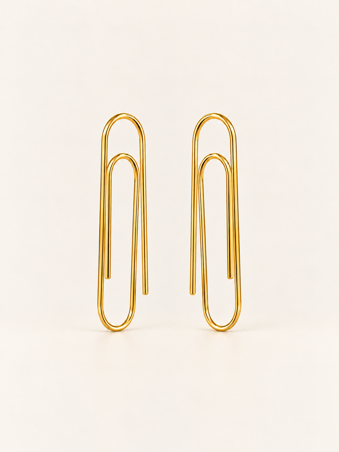 Gold Paperclip Earrings shown on a warm neutral background
