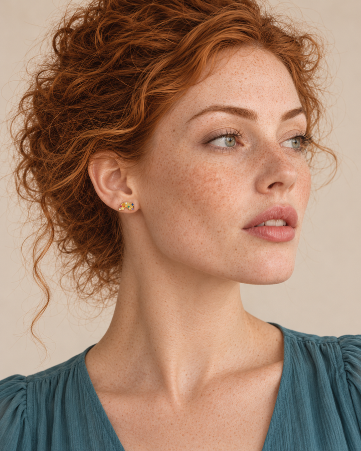 Gold Rainbow Stud Earrings worn on the viewer-left ear