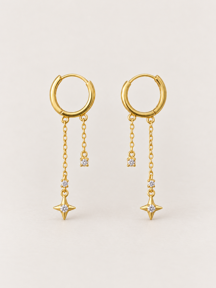 Gold Star Chain Hoop Earrings shown on a warm neutral background