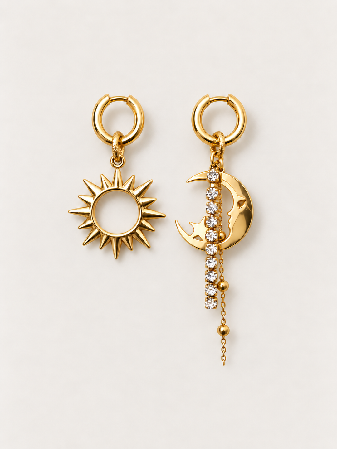 Gold Sun and Moon Drop Earrings shown on a warm neutral background