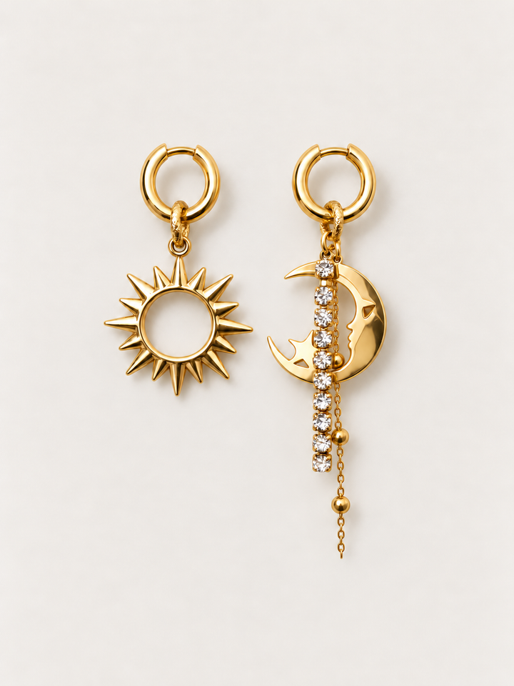 Gold Sun and Moon Drop Earrings shown on a warm neutral background