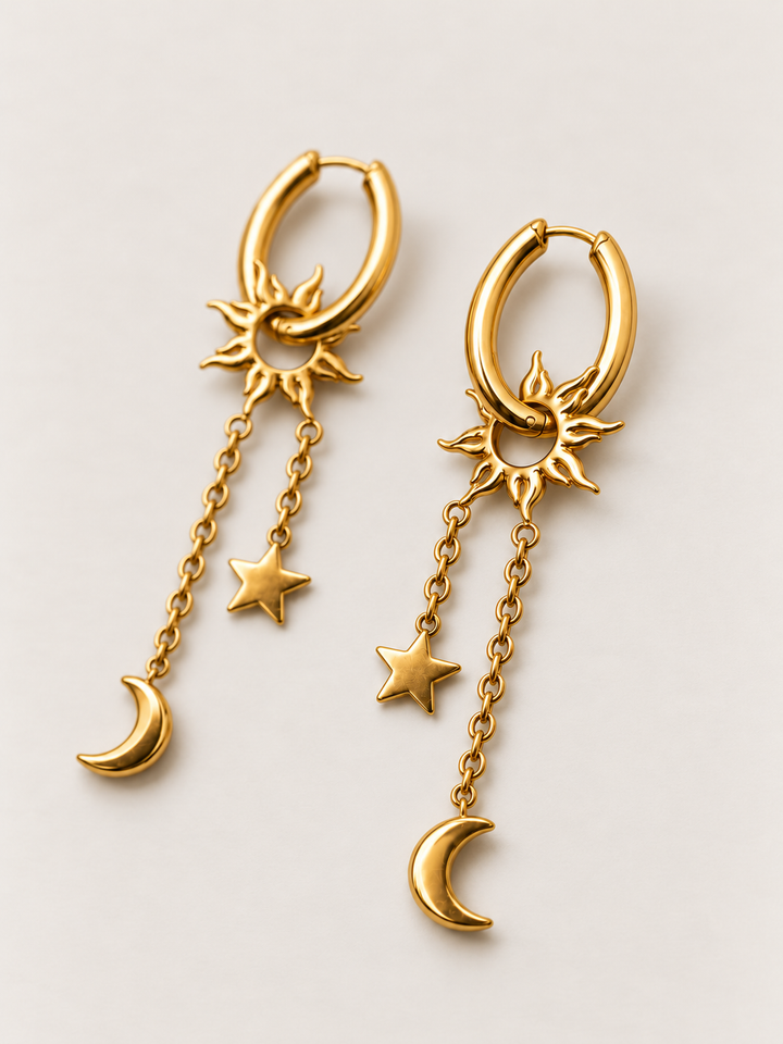 Gold Sun Moon Star Hoop Earrings shown angled on a warm neutral background