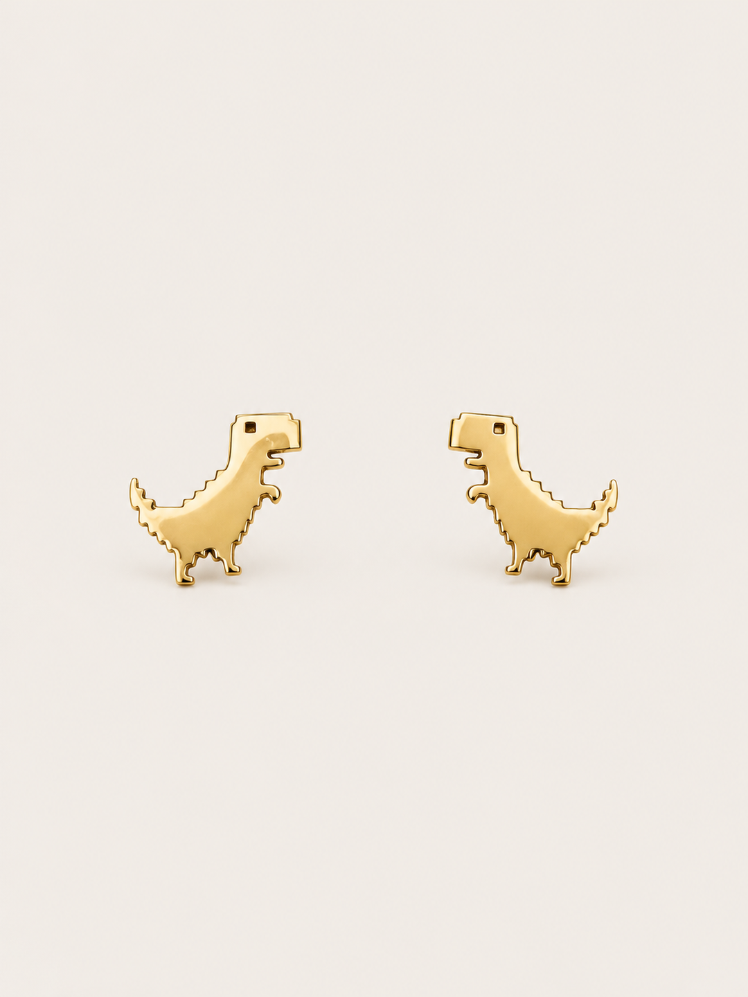 Gold T-Rex Stud Earrings shown on a warm neutral background