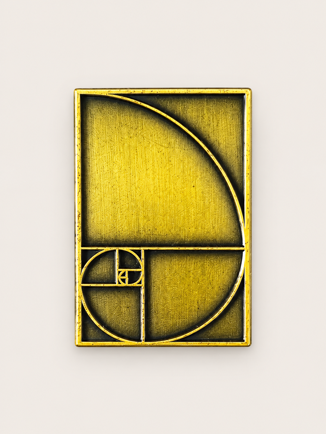 Golden Ratio Spiral Pin shown on a warm neutral background
