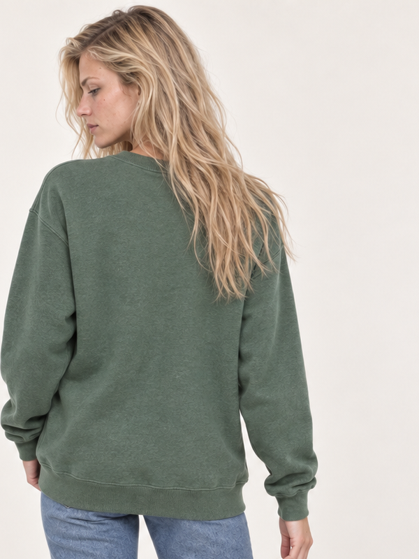 Model wearing sage green embroidered ghost campfire sweatshirt, blank back view