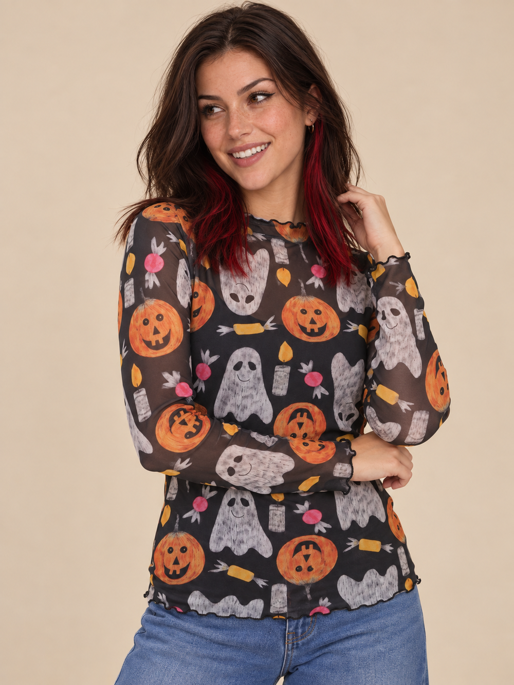 Model wearing Halloween sheer long sleeve spooky top, angled view