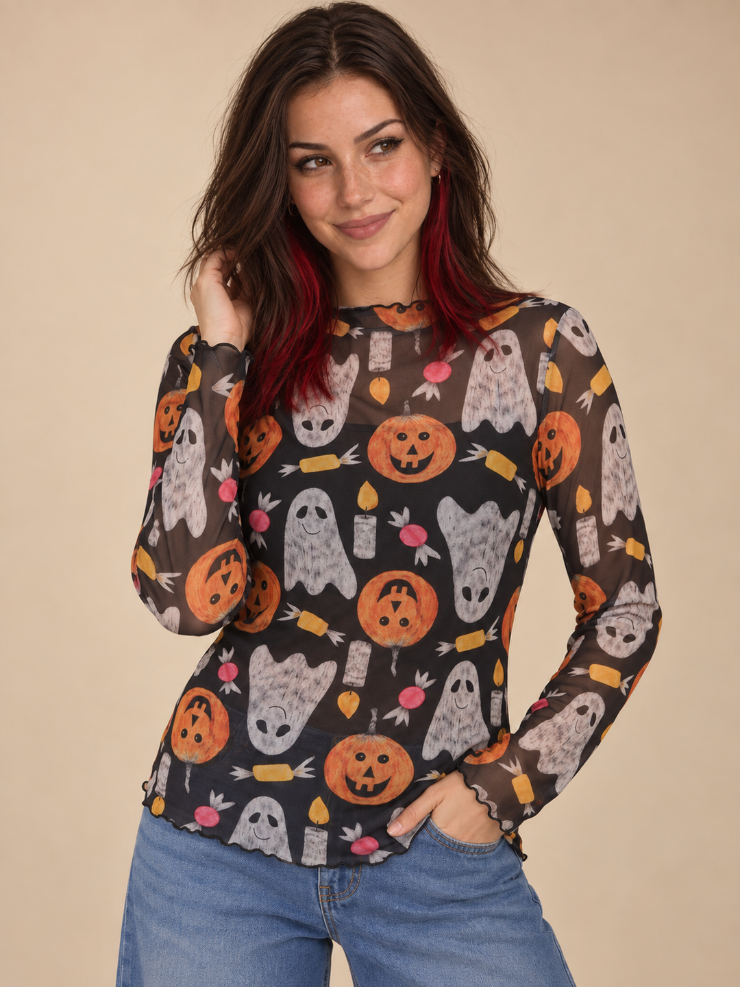 Model wearing Halloween sheer long sleeve spooky top, front view