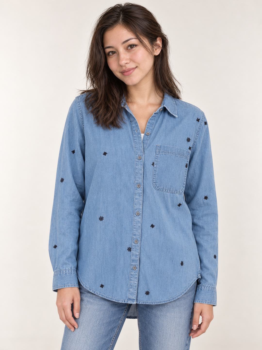 Model wearing Halloween spider button-down shirt, front view
