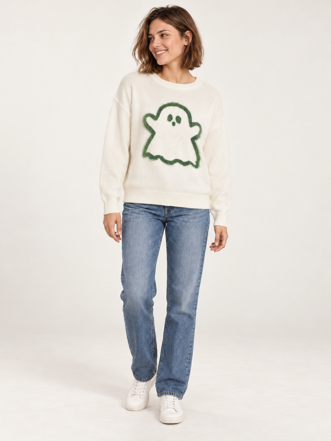 Ivory fuzzy ghost sweater with straight-leg jeans, full-body front view