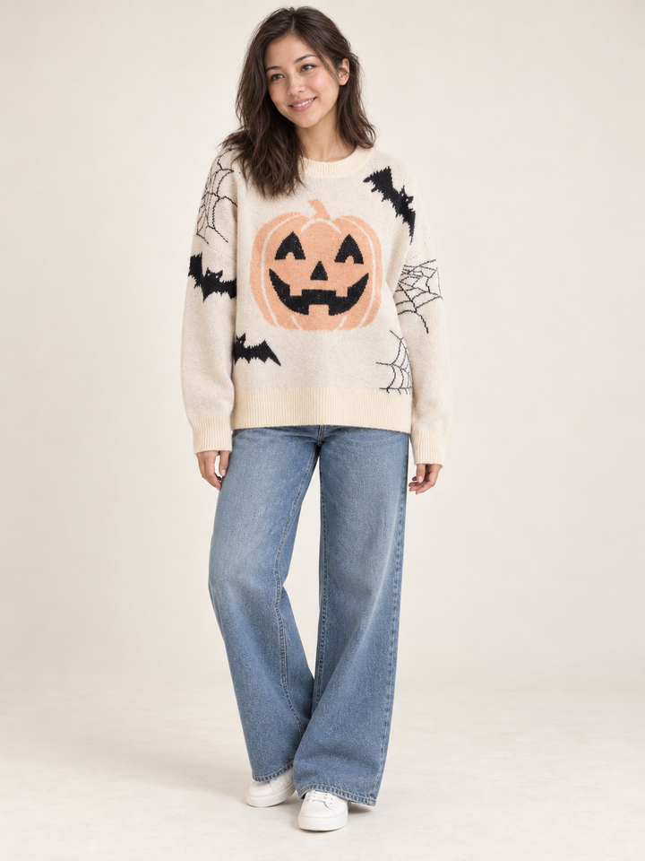 Cream pumpkin and bat Halloween sweater, full-body front view on model