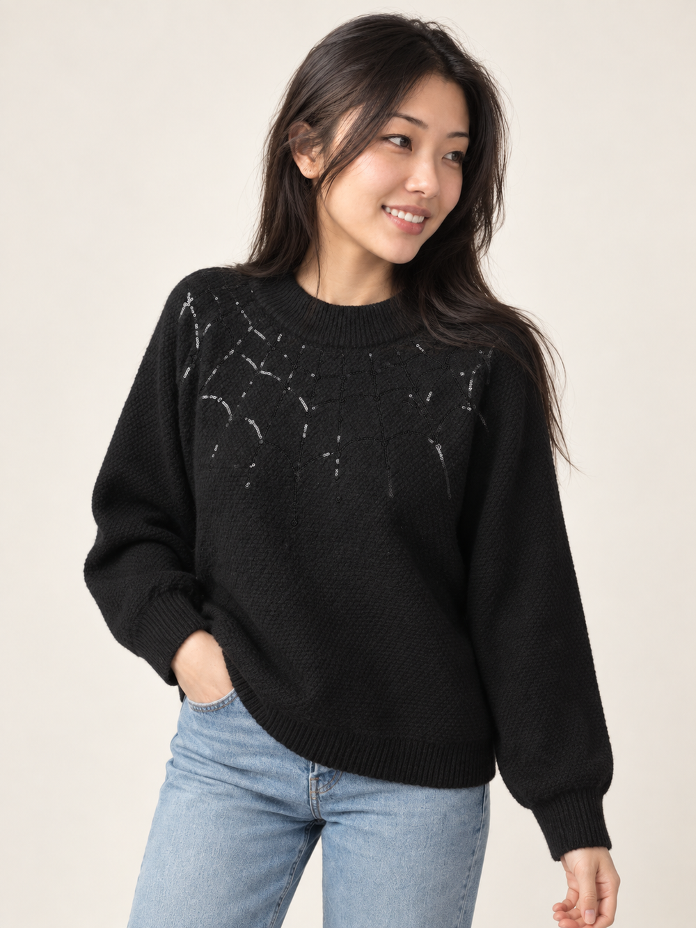 Model wearing Halloween Sweater Spider Web, angled view