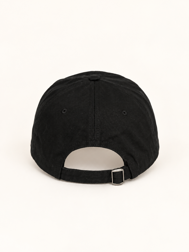 Back view of black baseball hat with adjustable strap and metal clasp
