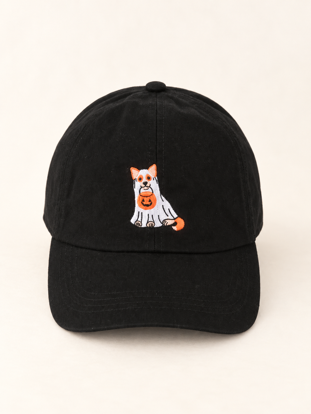 Front view of black hat with Halloween trick-or-treat dog embroidery