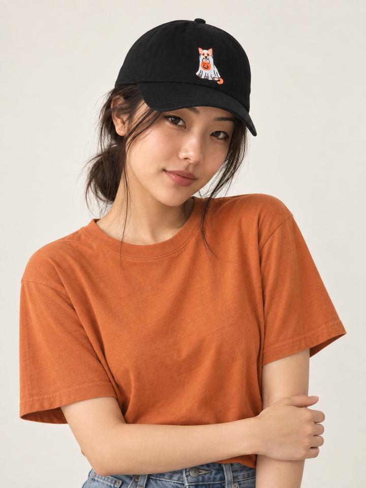 Model wearing the black Halloween trick-or-treat dog embroidered hat