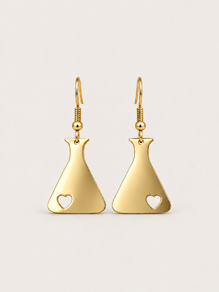 Gold Heart Flask Drop Earrings on a warm neutral background