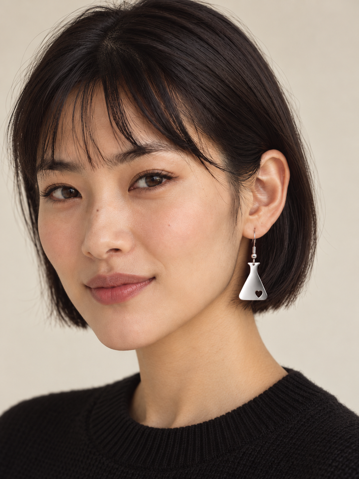 Silver Heart Flask Drop Earrings worn on a model