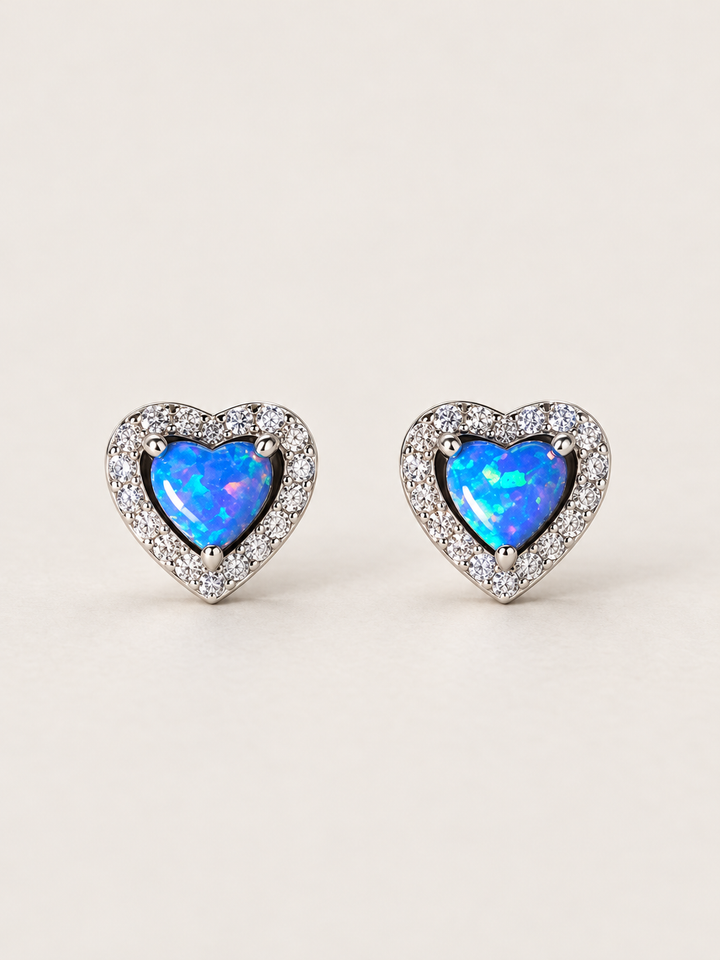 Blue Heart Halo Stud Earrings shown on a warm neutral background