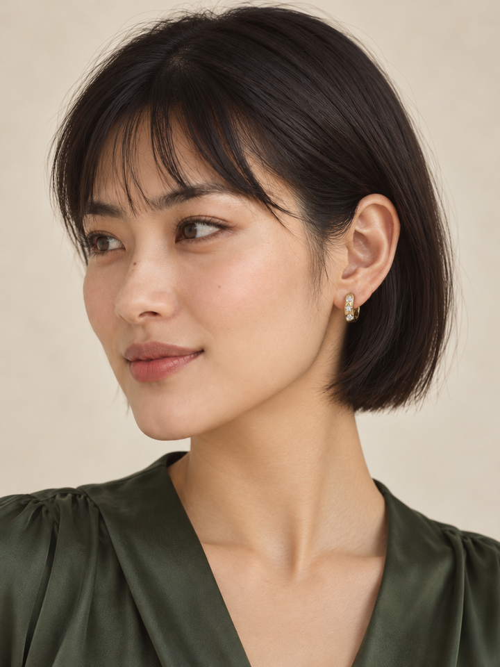 Heart and Star Huggie Earrings worn on a model