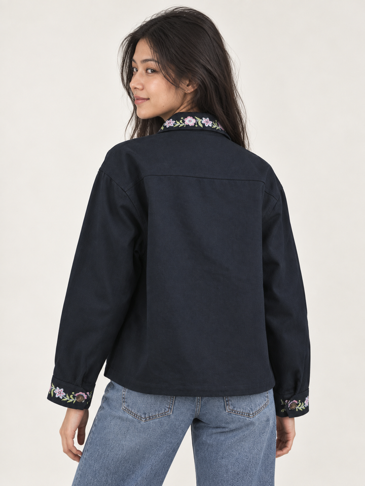 Model wearing Horse Embroidered Cotton Navy Jacket, back view