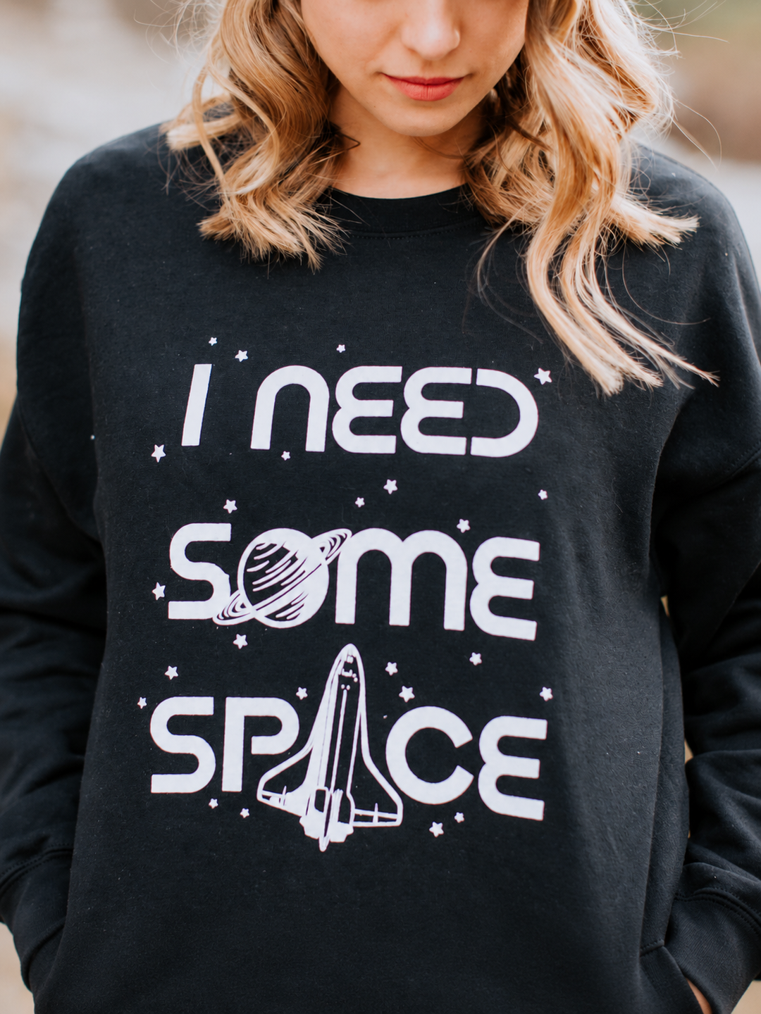 Close-up of black I Need Some Space sweatshirt