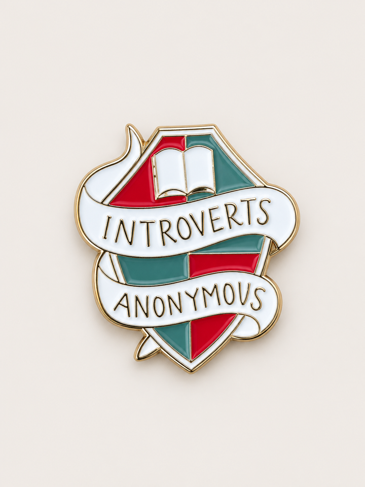 Introverts Anonymous Book Pin shown on a warm neutral background
