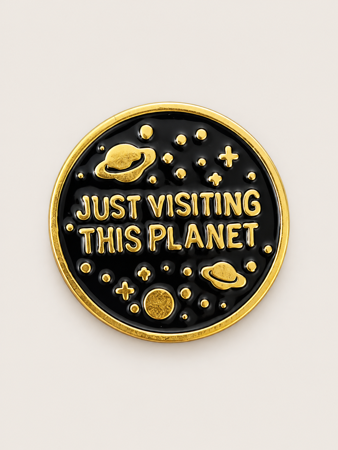 Just Visiting This Planet Pin shown on a warm neutral background
