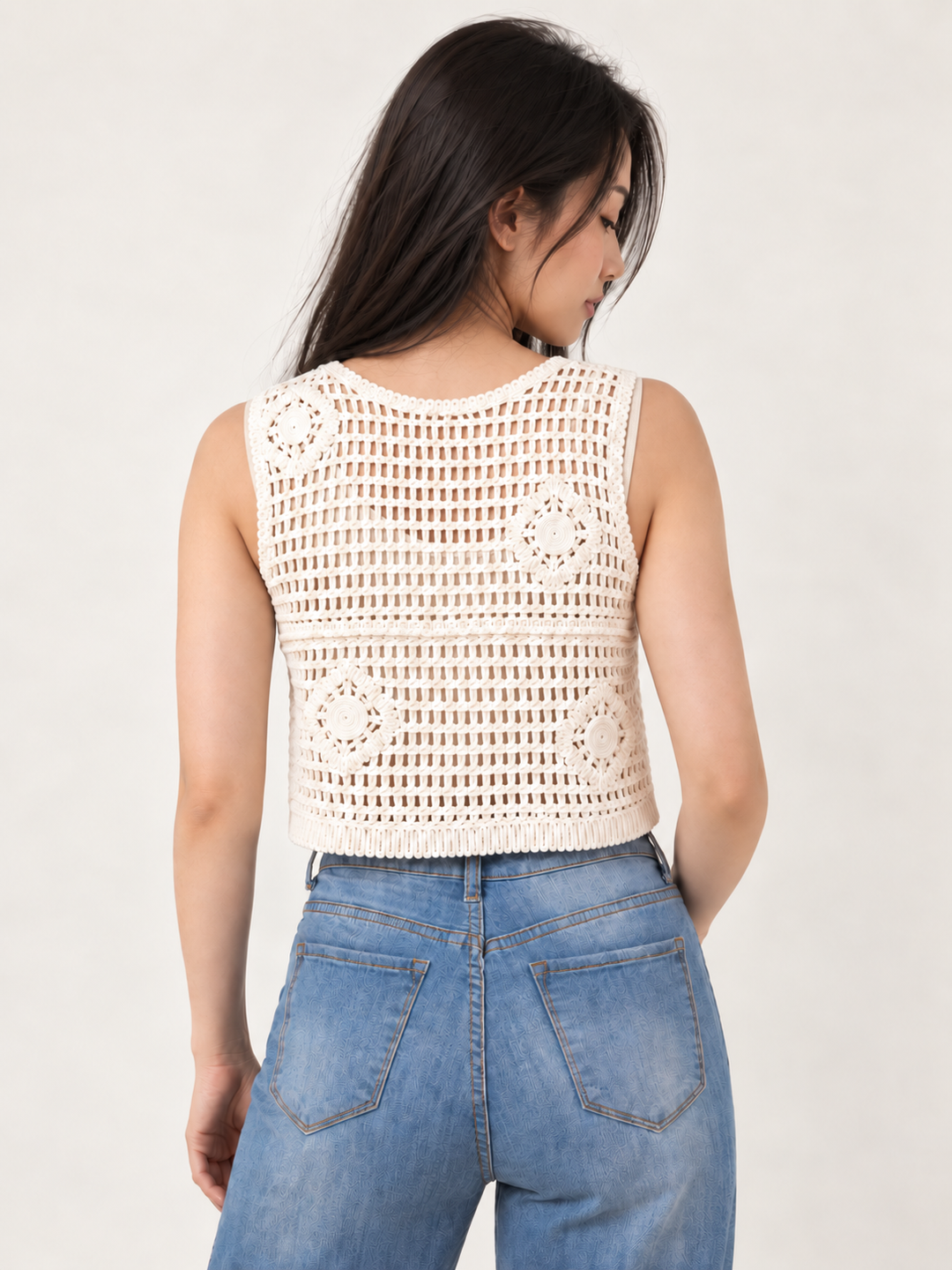 Model wearing Knit Button Up Vest Tan over cream tank, back view