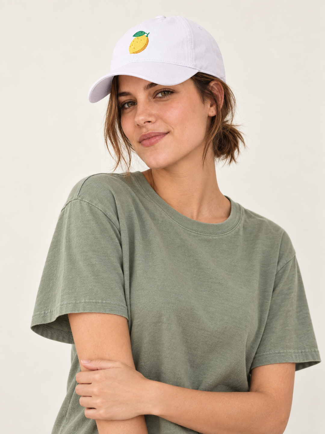 Model wearing the white embroidered Lemon Hat