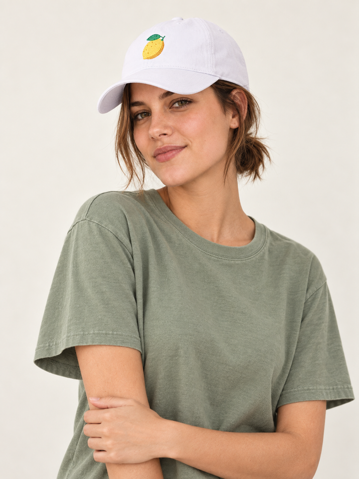 Model wearing the white embroidered Lemon Hat