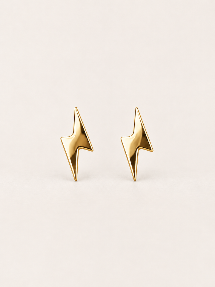 Gold Lightning Bolt Stud Earrings shown on a warm neutral background