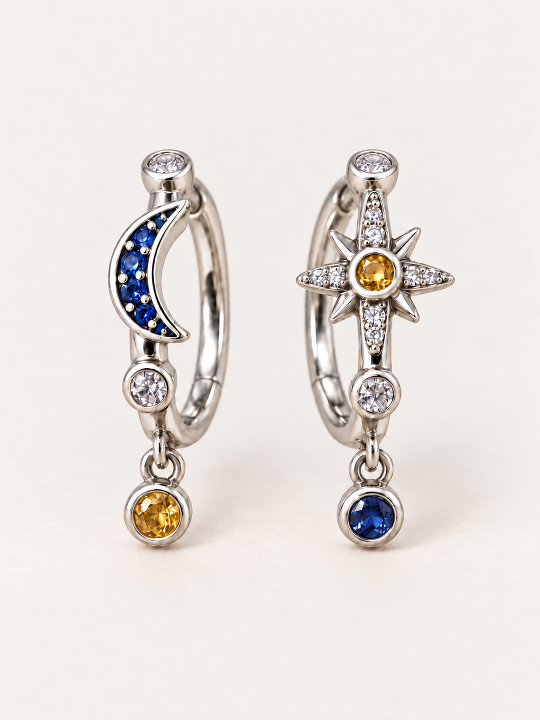 Moon and Star Charm Hoop Earrings shown on a warm neutral background