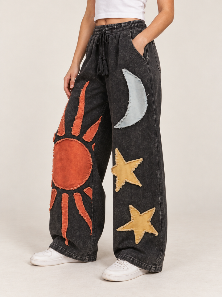 Model wearing Moon and Star Patchwork Wide Leg Pants, angled view