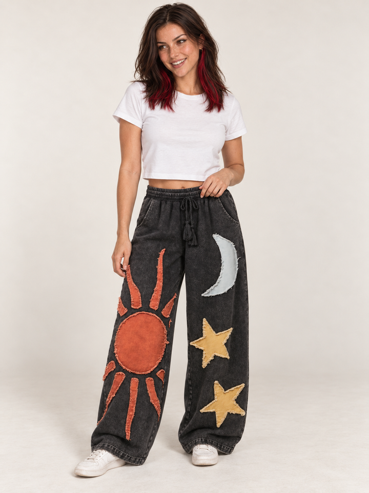 Model wearing Moon and Star Patchwork Wide Leg Pants, front view