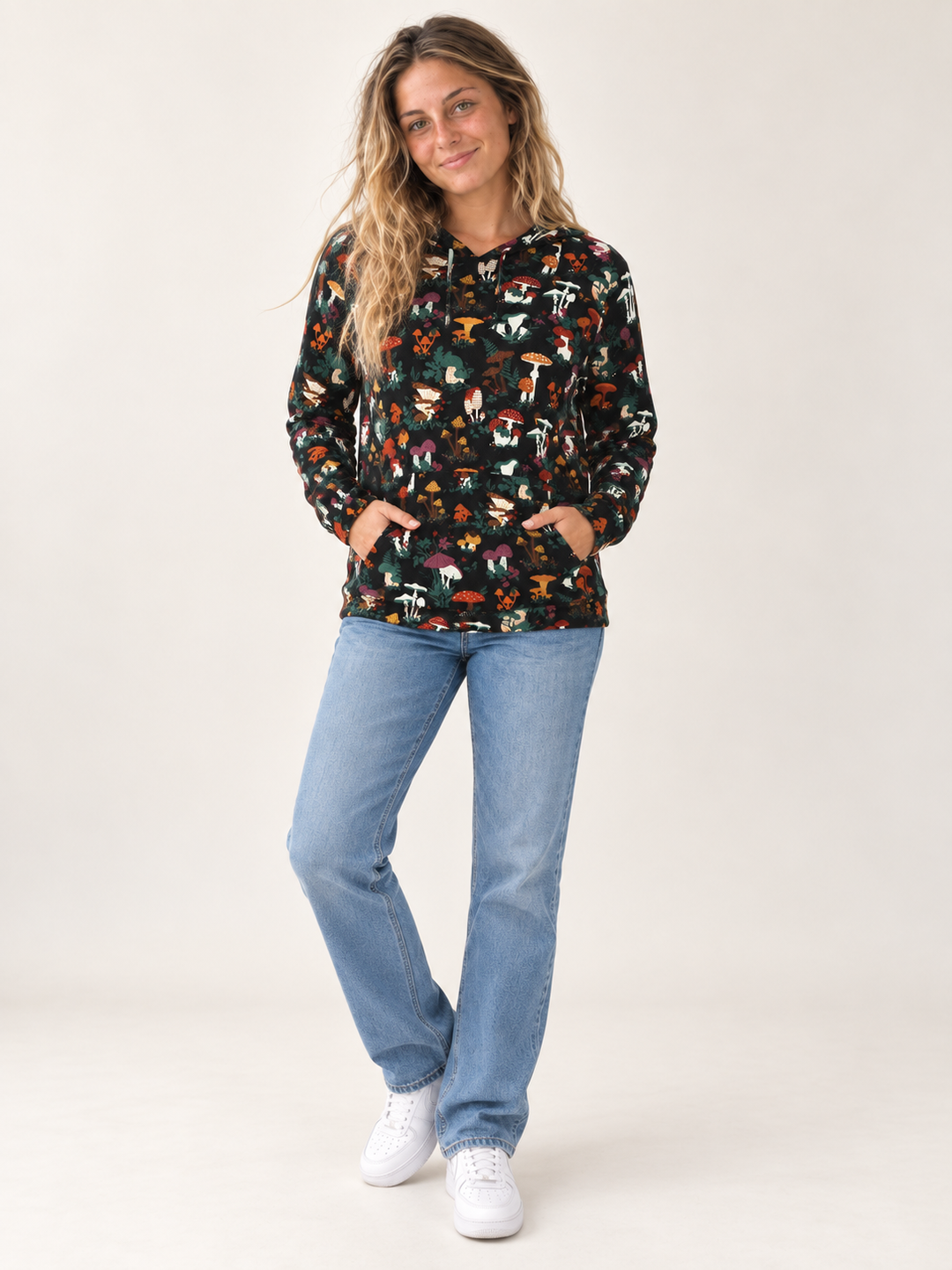 Model wearing Mushroom Garden Hoodie, full-body front view