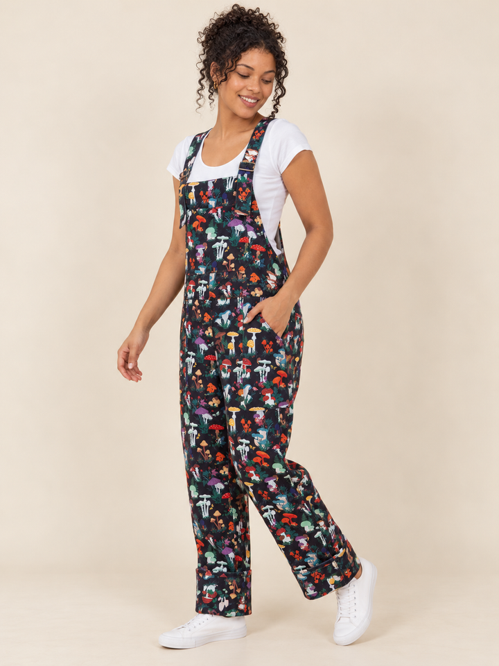 Model wearing Mushroom Garden Overalls, three-quarter view