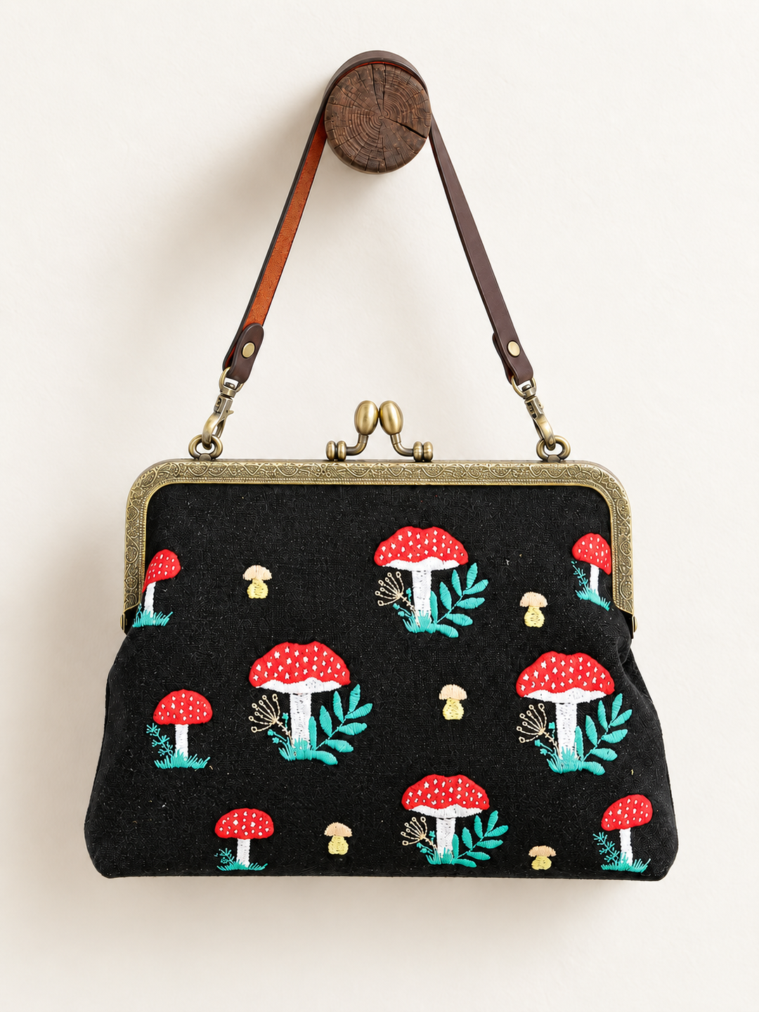 Mushroom Kisslock Bag hanging from short strap