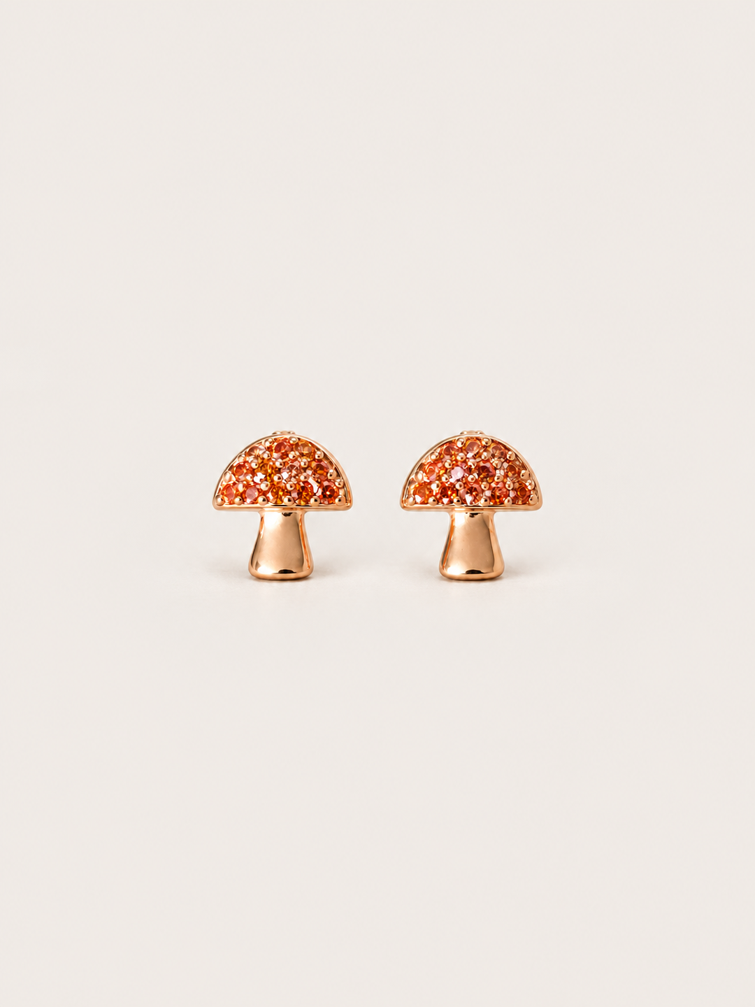 Mushroom Stud Earrings shown on a warm neutral background